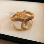 Gold Tone Interlocking Loop Cuff Bangle, Ribbed Hinged Bangle