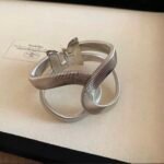 Silver Tone Interlocking Loop Cuff Bracelet, Ribbed Hinged Bangle